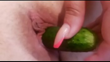 Ukrainian woman fucks her vagina with a cucumber and takes a close-up picture